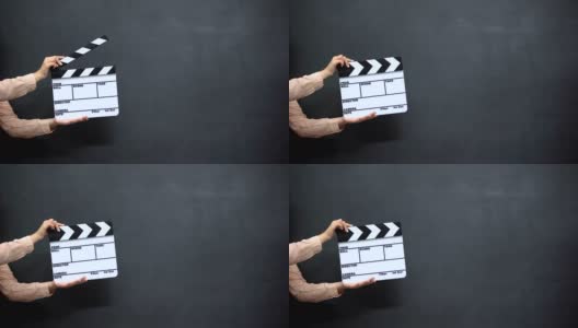 女性用手在黑色背景下用挡板拍摄电影高清在线视频素材下载