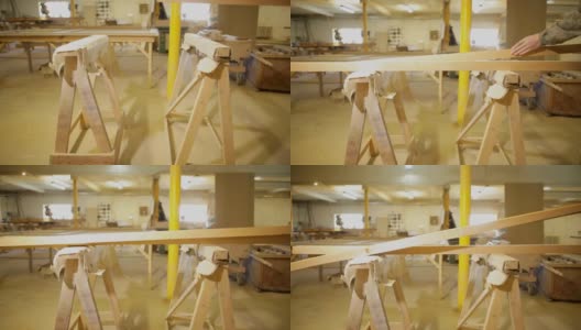 木匠或细木工将木条或梁木材进一步刨平在家具车间高清在线视频素材下载