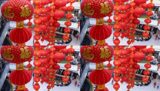 拍摄商场天花板上的传统红灯笼。春节庆祝活动高清在线视频素材下载