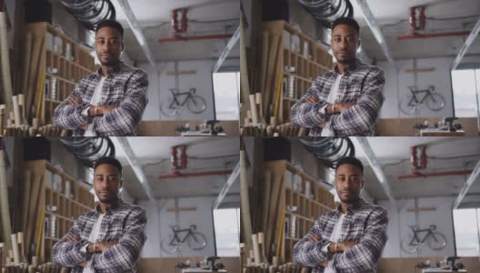 在建造可持续竹制自行车工作坊的年轻男性企业主肖像高清在线视频素材下载