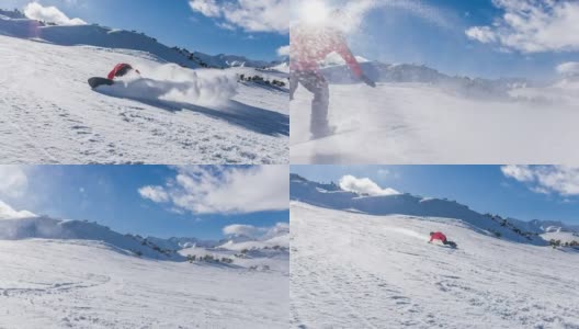 在一个阳光明媚的日子里，滑雪者从滑雪坡上滑下来，将雪喷向摄像机高清在线视频素材下载