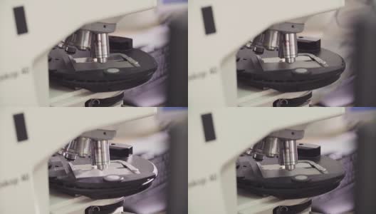 在光学显微镜镜头下滑动玻璃高清在线视频素材下载