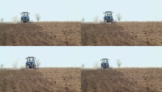 农用拖拉机在播种前犁地高清在线视频素材下载