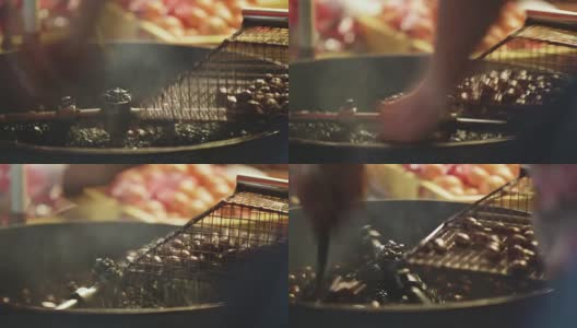 晚上在马来西亚的一个食品市场烤栗子高清在线视频素材下载