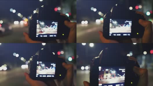 一名女子在城市拍摄夜景。高清在线视频素材下载