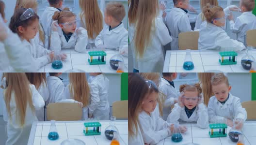 小学化学课-化学实验。孩子们在学校的实验室里学习化学高清在线视频素材下载