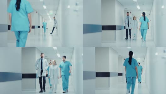 一队医生，外科医生和护士走过繁忙的医院走廊，他们谈论病人，即将进行的手术和拯救生命。拥有专业人员的干净现代医院。高清在线视频素材下载
