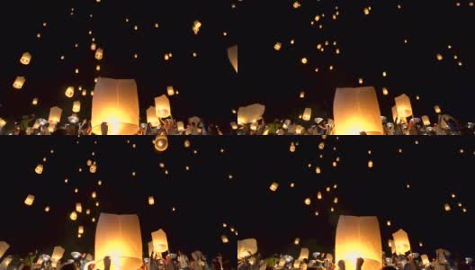 特写手推出浮动灯笼与大佛背景在河灯节，兰芬，泰国北部高清在线视频素材下载