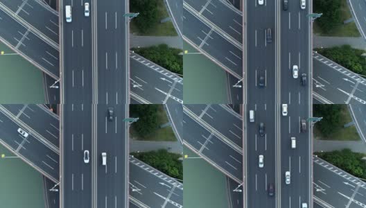 无人机的高速公路多层次交叉道路与移动的汽车在日落。汽车在多层路口行驶，是城市的概念。苏州城市,中国。高清在线视频素材下载