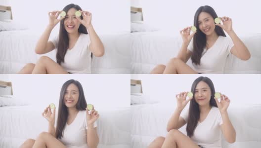 有趣快乐的亚洲女人做黄瓜面膜高清在线视频素材下载