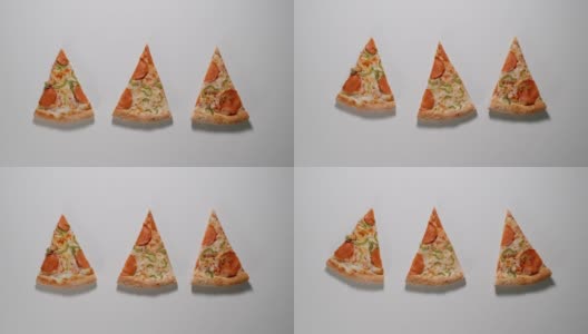 披萨片在白色的表面上摇晃，停止运动高清在线视频素材下载