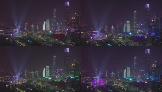 夜景照亮了广州市著名的现代市中心滨江体育场，4k中国航拍全景高清在线视频素材下载