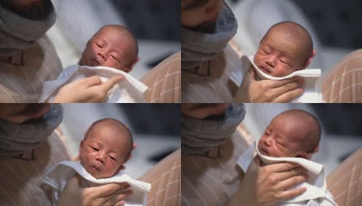 亚洲母亲给婴儿喂奶后打嗝高清在线视频素材下载