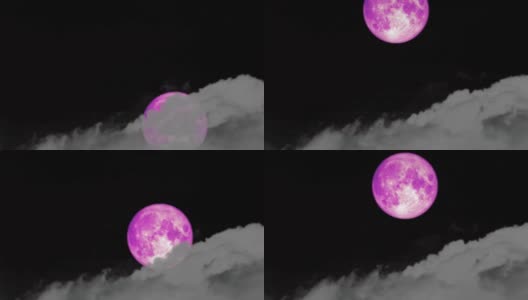 随着时间的流逝，超级粉红的月亮从夜空的乌云中升起高清在线视频素材下载