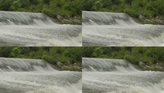 河大坝。水流出一条小河的堤坝。发展灌溉高清在线视频素材下载