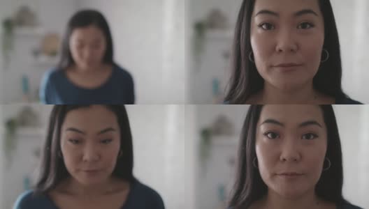 漂亮的年轻亚洲女人看着相机的大头照高清在线视频素材下载