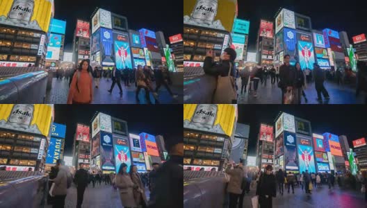 4k时光流逝:在日本大阪道顿堀，人们走在夜间购物街上高清在线视频素材下载