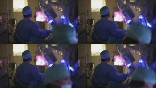 外科医生操作机器人手术机器的外科医生高清在线视频素材下载