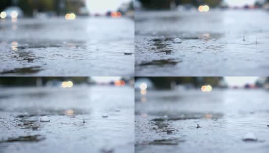 雨天的城市街道，水滴，水坑，汽车经过，超慢的动作，选择性聚焦。高清在线视频素材下载