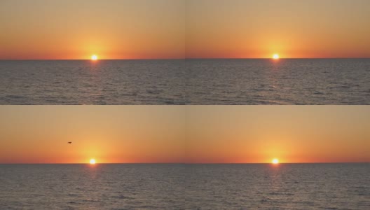 橙色的日落。日落海景。黄红的太阳沉入大海。美丽的日落在海上高清在线视频素材下载