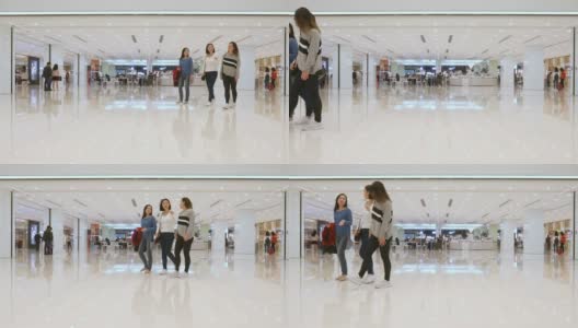 一群年轻的亚洲女性走过购物中心高清在线视频素材下载