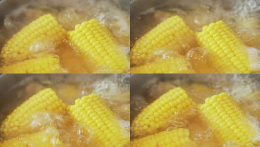 鲜亮多汁的黄色玉米的质地，在炉子上的沸水中煮沸。美味的年轻甜玉米。富含维生素的夏季健康蔬菜。宏高清在线视频素材下载