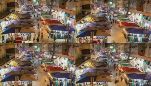 香港九龙弥敦道旺角花苑跳蚤市场夜间游人拥挤高清在线视频素材下载