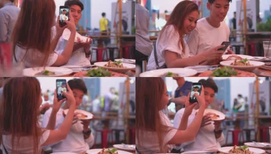 一个年轻女子在餐厅和他的男友自拍高清在线视频素材下载
