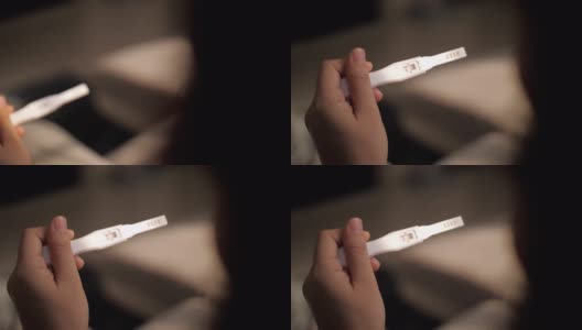 妇女的手妊娠测试呈阳性高清在线视频素材下载
