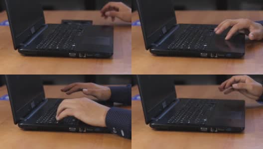 一位年轻的IT技术人员将一张CD插入笔记本电脑，播放一种针对计算机过程中重要变化的特殊程序。视频拍摄全高清60帧/秒。高清在线视频素材下载