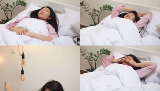 年轻的中国女人躺在床上高清在线视频素材下载