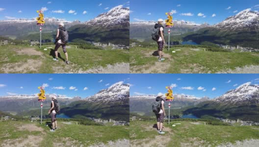 在瑞士徒步旅行的女背包客高清在线视频素材下载