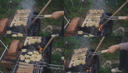 在炭火上烤羊肉串的过程。在乡下度假在乡下度假高清在线视频素材下载