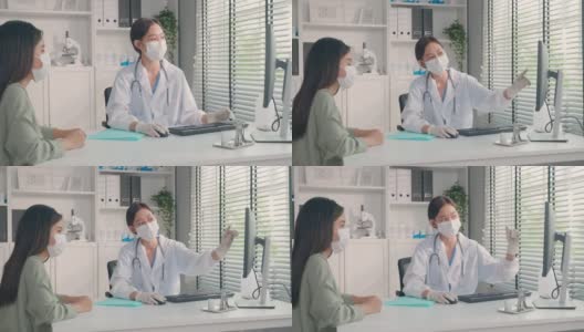 亚洲专科女医生给小女孩病人讲解诊断。专业女医生佩戴口罩，使用笔记本电脑，及时向住院病人提供治疗方案。高清在线视频素材下载