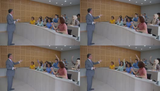 好奇的大学生向男老师举手提问高清在线视频素材下载