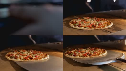 特写人物打开门从烤箱里拿出意大利披萨高清在线视频素材下载