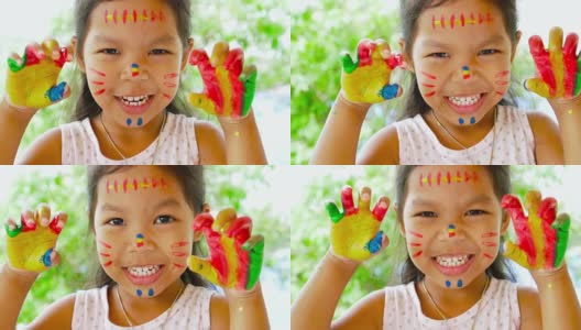 亚洲女孩展示她的绘画手的特写慢动作拍摄100帧/秒高清在线视频素材下载