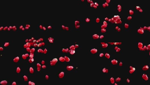 成熟的红石榴子在黑色背景上飞舞高清在线视频素材下载
