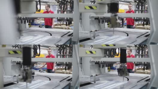 在仓库操作工厂机器的工人高清在线视频素材下载