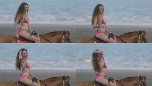 在海边骑马的年轻女子高清在线视频素材下载