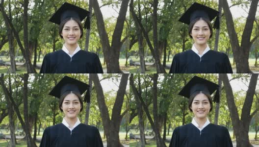 年轻的亚洲女学生戴着毕业帽和礼服，花园背景，女性与毕业概念。高清在线视频素材下载