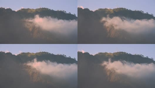 雾流过树木和山附近的布罗莫山，印度尼西亚高清在线视频素材下载