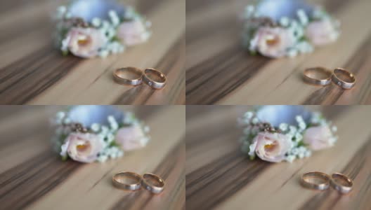 胸针和结婚戒指放在一块木板上高清在线视频素材下载