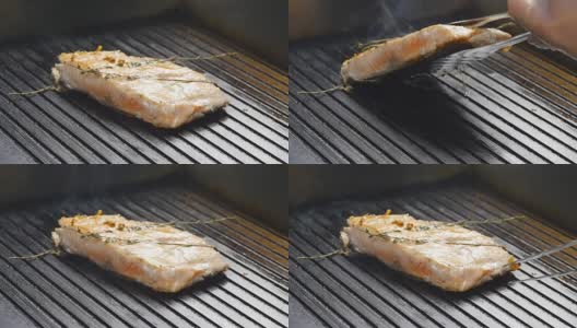 慢动作烤架上的烤红鱼牛排鲑鱼高清在线视频素材下载