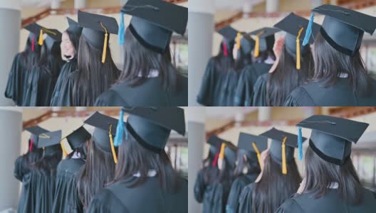 毕业典礼那天，毕业生们在大学里抛帽子。高清在线视频素材下载