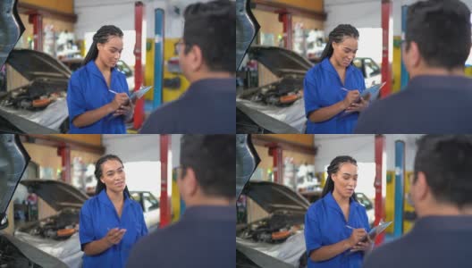 汽车技工在汽车修理店做客户清单高清在线视频素材下载