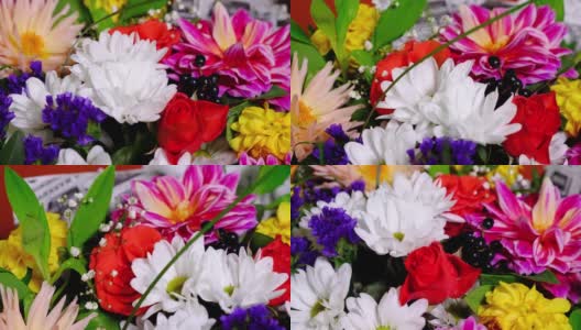 旋转着美丽鲜艳的菊花和玫瑰花束。给女人最好的礼物。高清在线视频素材下载