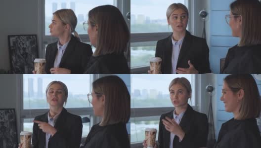 三个职场女性晚上下班后在办公室里喝咖啡，休息的时候聊新项目高清在线视频素材下载