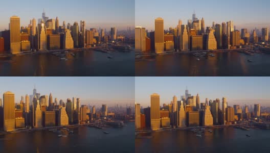 横跨东河的曼哈顿市中心鸟瞰图，黎明时分，轮船从11号码头和炮台海事码头进进出出。无人机视频与平移小车摄像机运动。高清在线视频素材下载