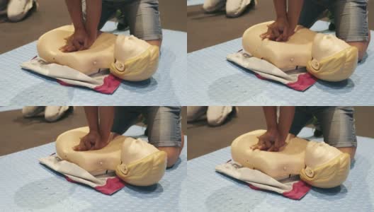 4K慢动作:CPR培训课程演示泵入假人，救援紧急情况或医疗保健概念。高清在线视频素材下载